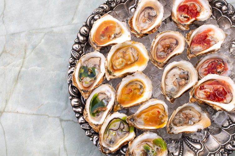 A platter of oysters on ice.
