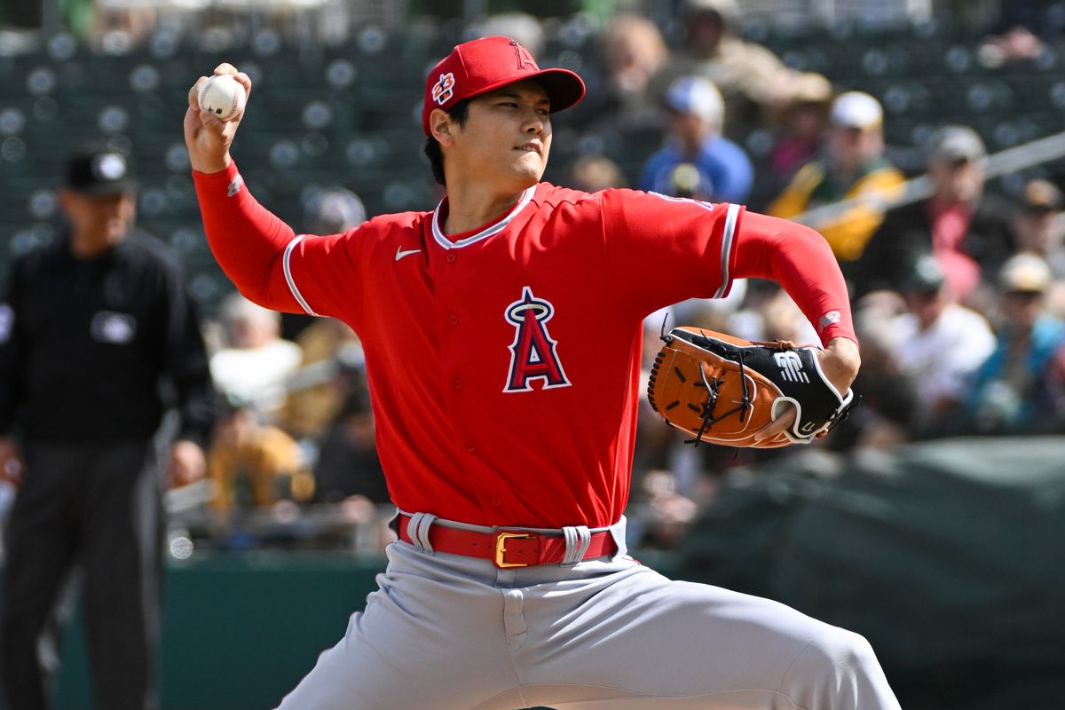 Shohei Ohtani #17 of the Los Angeles Angels throws a pitch during the first inning of a spring training game against the Oakland Athletics at Hohokam Stadium on February 28, 2023 in Mesa, Arizona.