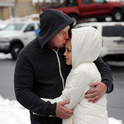 Rocky Catenzaro kisses daughter Kenya as they are reunited following a shooting at Mueller Park Junior High School in Bountiful on Thursday, Dec. 1, 2016. Kenya was walking into the school when she was told to get out due to the shooting.