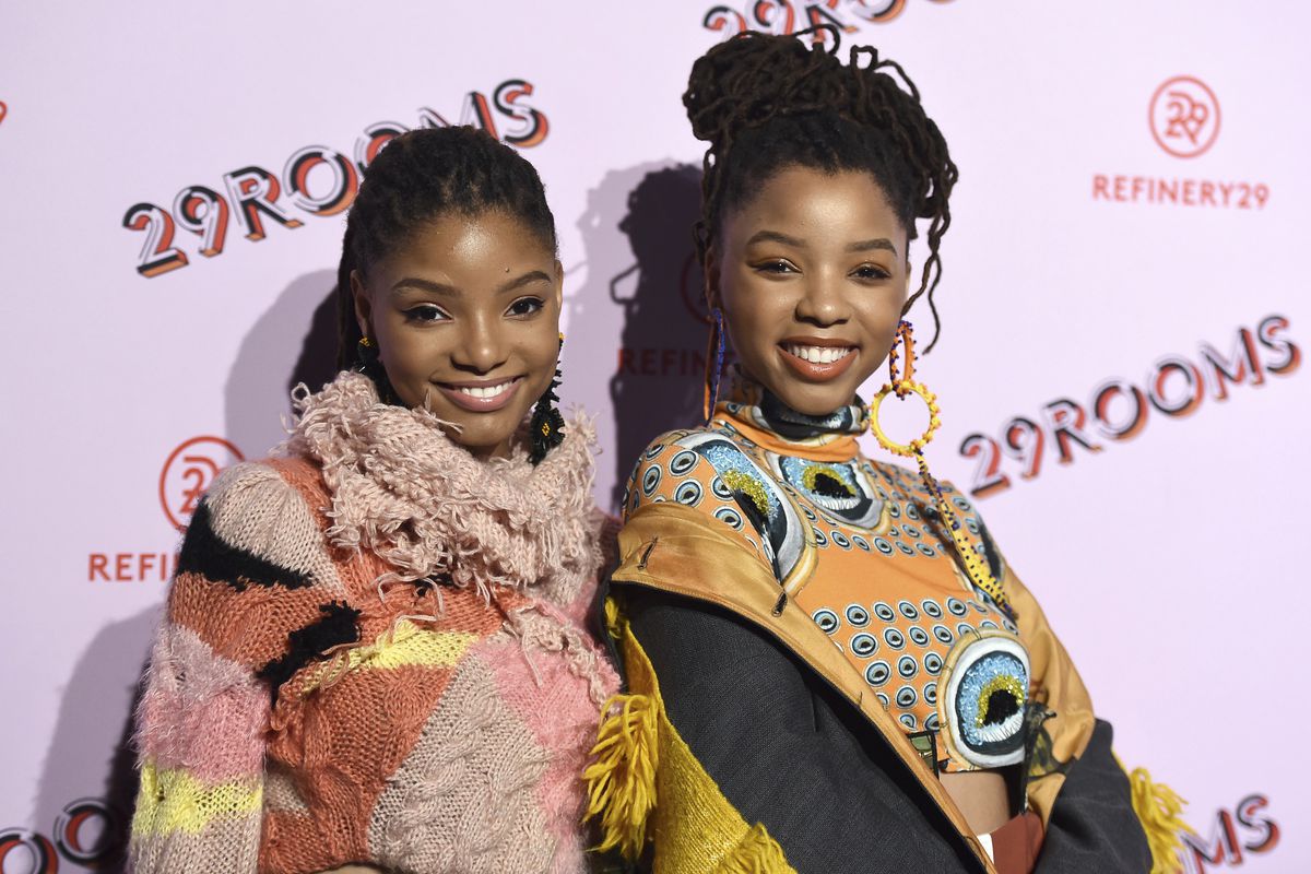 Halle Bailey, left, and Chloe Bailey, of Chloe x Halle, arrives at the West Coast debut of 29rooms at ROW DTLA on Wednesday, Dec. 6, 2017, in Los Angeles.