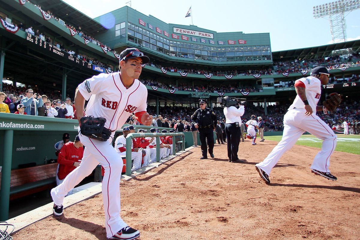 BOSTON, MA:  Jacoby Ellsbury #2 of the Boston Red Sox runs out on to the field before the start of the first inning against the Tampa Bay Rays during the home opener at Fenway Park in Boston, Massachusetts.  (Photo by Elsa/Getty Images)