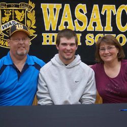 SONY DSC Wasatch senior Kyle Kelly poses with his proud parents after signing his national letter of intent to play baseball for the College of Eastern Utah.