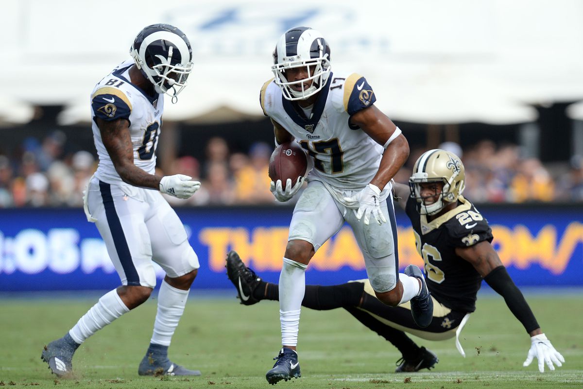 Los Angeles Rams wide receiver Robert Woods runs the ball ahead of New Orleans Saints cornerback P.J. Williams during the second half at Los Angeles Memorial Coliseum.