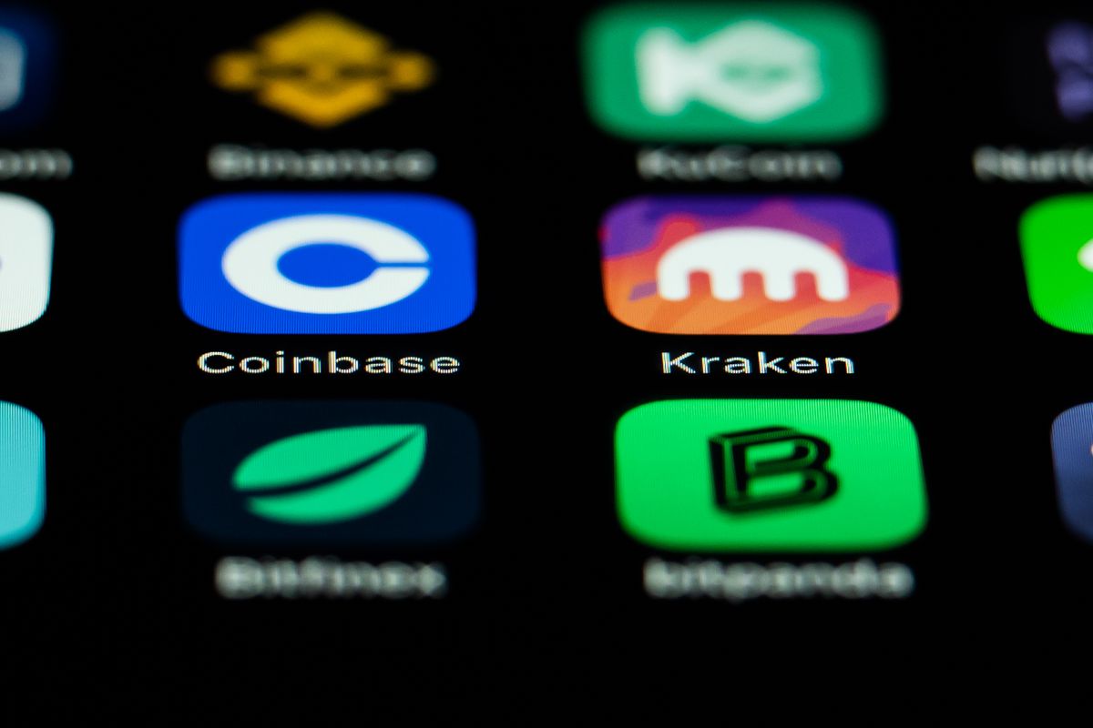 A phone screen showing app icons for cryptocurrency companies.