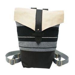Hand-woven in Oaxaca, Mexico and assembled in Oakland, CA, for those who are concerned with that sort of thing. <a href="http://jobandboss.com/oaxaca-woven-collection/black-nude-leather-backpack">Black & Nude Backpack</a>,  $375 at Job & Boss.