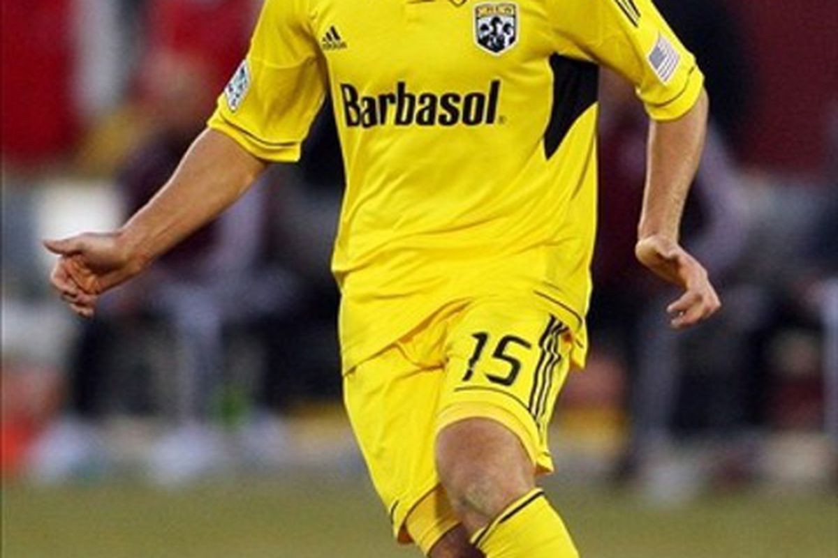 March 10, 2012; Denver, CO, USA;  Columbus Crew midfielder Kirk Urso (15) controls the ball during the second half against the Colorado Rapids at the Dick's Sporting Goods Park.  Mandatory Credit: Chris Humphreys-US PRESSWIRE