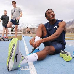 Shaquille Walker gets his shoes on as he works out Monday, Feb. 9, 2015, with other members of the BYU track team in Provo.