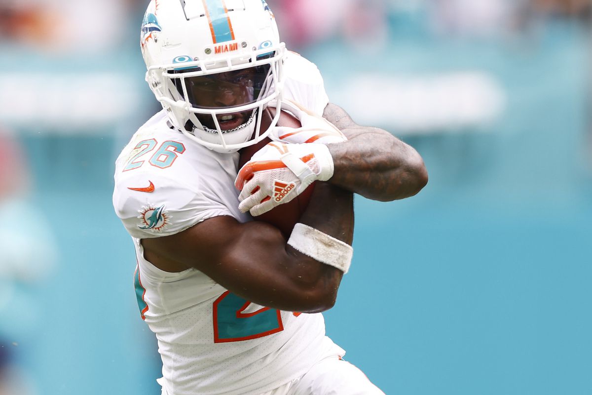 Salvon Ahmed #26 of the Miami Dolphins runs with the ball against the Atlanta Falcons at Hard Rock Stadium on October 24, 2021 in Miami Gardens, Florida.
