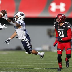 Brigham Young defensive back Troy Warner, left, breaks up a pass intended for Cincinnati wide receiver Devin Gray (21) during the first half of an NCAA college football game, Saturday, Nov. 5, 2016, in Cincinnati. (AP Photo/Gary Landers)