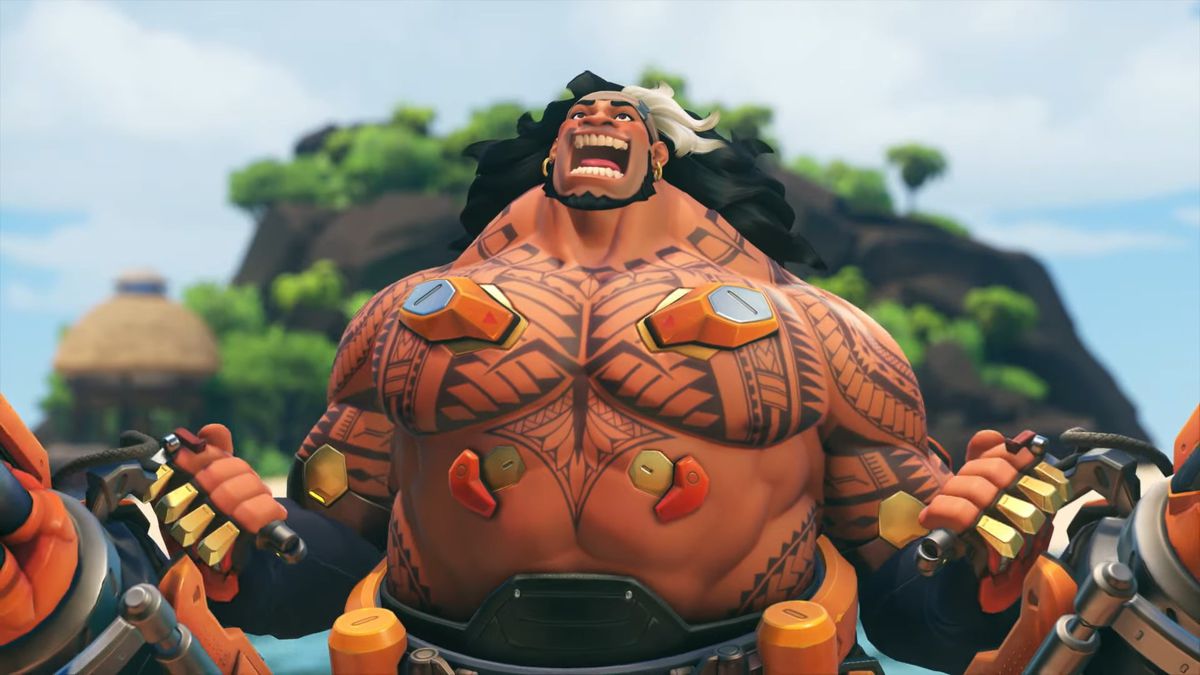 Tank fighter Mauga stretches out his chest and flexes, his yelling face upturned towards the sky