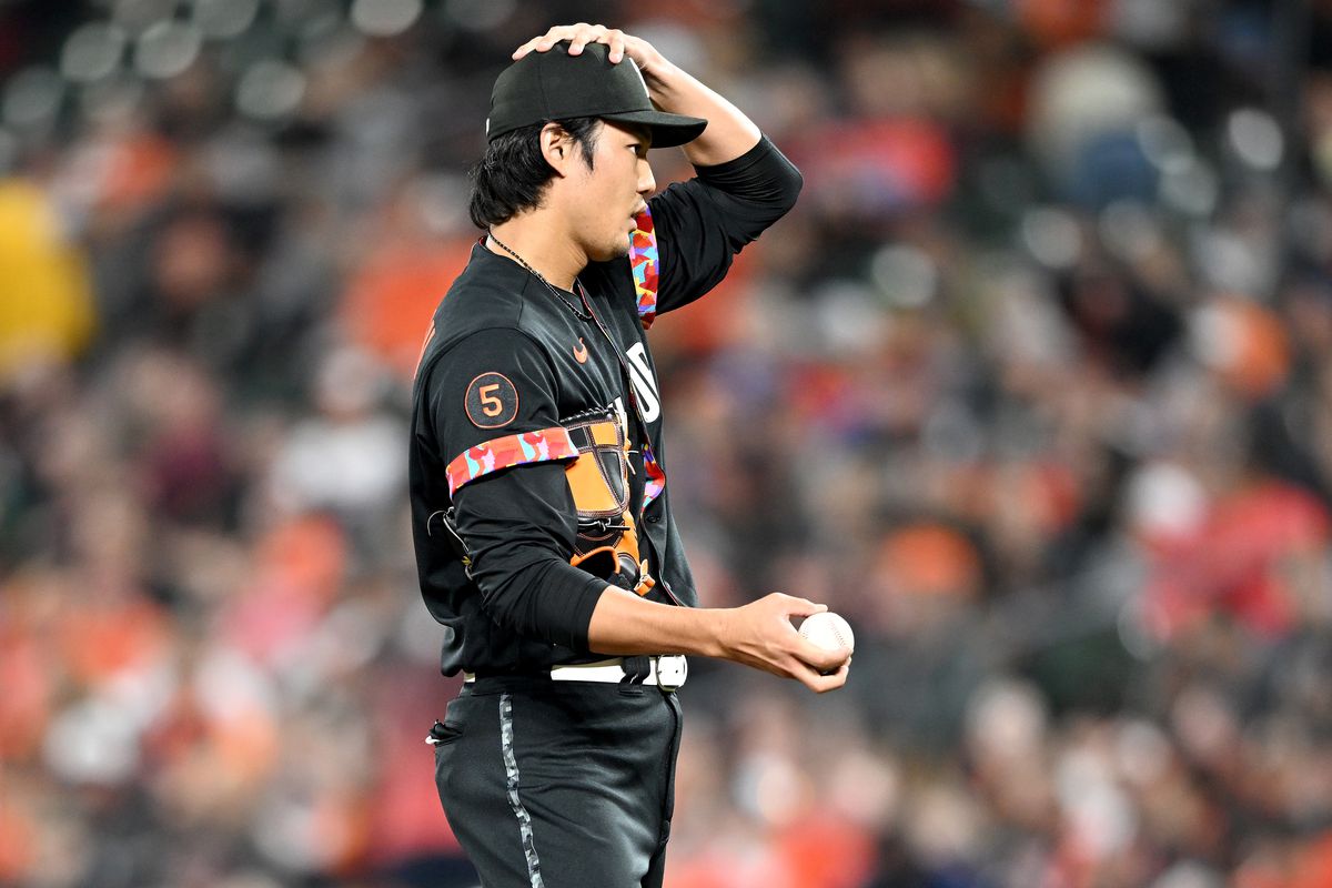 Shintaro Fujinami of the Baltimore Orioles reacts to a play in the ninth inning against the Boston Red Sox at Oriole Park at Camden Yards on September 29, 2023 in Baltimore, Maryland.