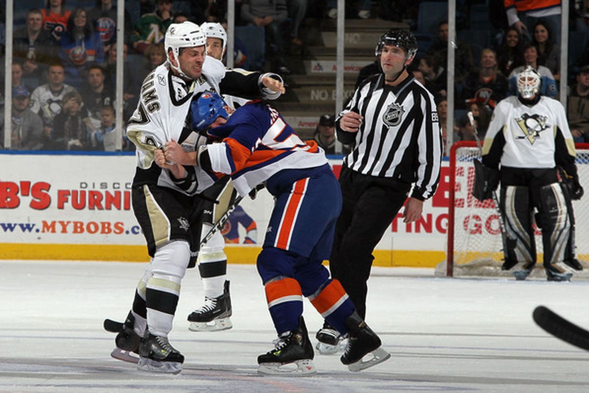 UNIONDALE NY - FEBRUARY 11:  Craig Adams #27 of the Pittsburgh Penguins fights Michael Haley #59 of the New York Islanders during the first period on February 11 2011 at Nassau Coliseum in Uniondale New York.  (Photo by Jim McIsaac/Getty Images)