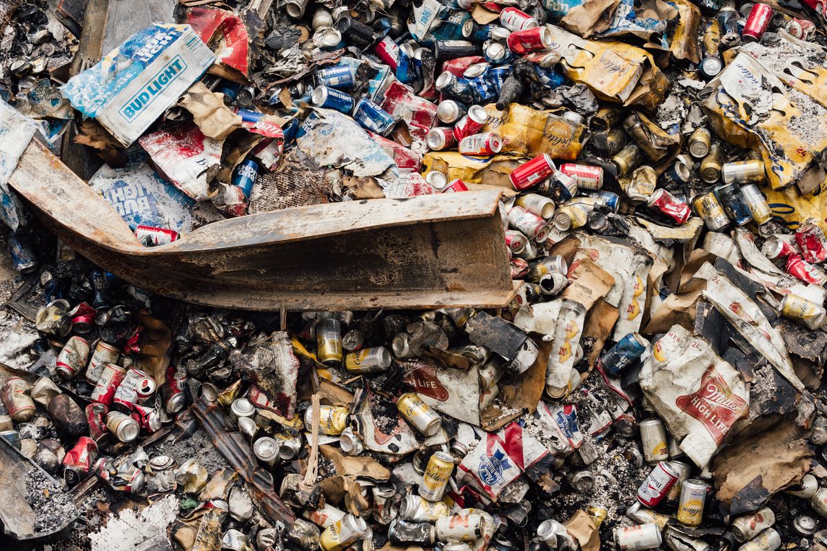 A charred pile of beer cans
