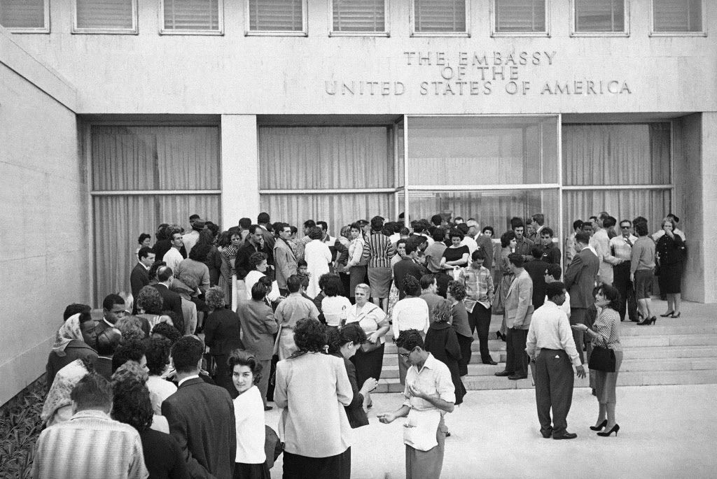 <small><strong>This Jan. 3, 1961 file photo shows Cubans lining up outside the U.S. embassy in hopes of getting visas after President Fidel Castro ordered the embassy to reduce its staff within 48 hours in Havana, Cuba. After the diplomatic break in 1961,