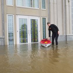 Using kayaks, Christine Haines, daughter of Albert Haines, a counselor in the Houston Texas Temple presidency, and a friend checked on the flooding surrounding the temple on Monday, Aug. 28, 2017.