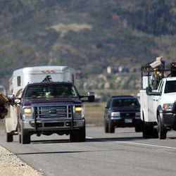 Jess Jones rides Chief in the Grass March Cowboy Express on I-80 in Park City on Thursday, Oct. 2, 2014.