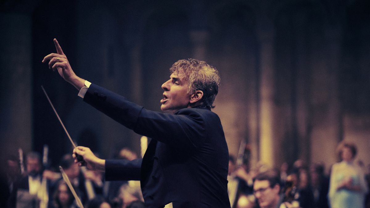 Bradley Cooper passionately conducting as Leonard Bernstein in Netflix’s Maestro