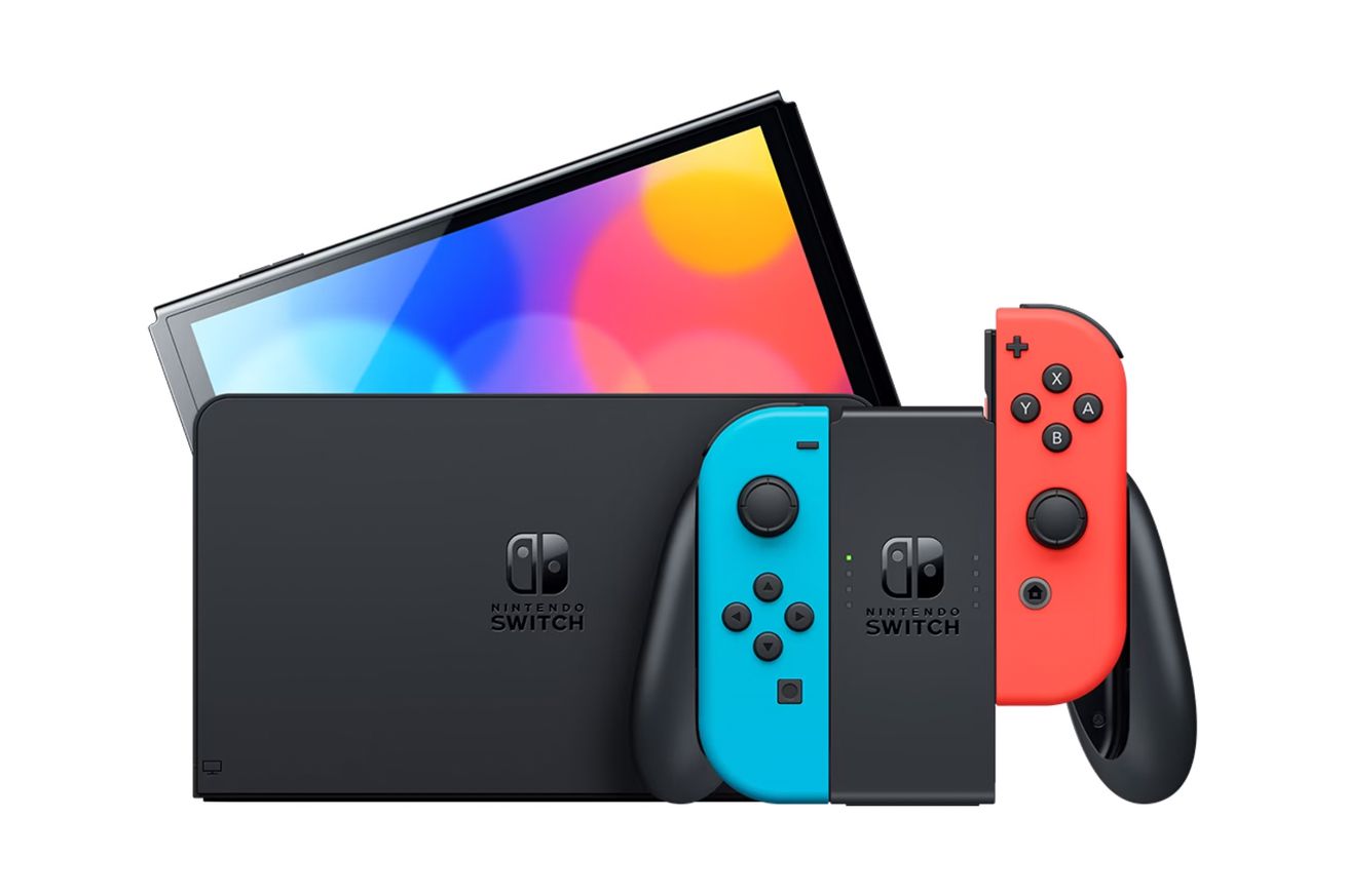 A close-up image of a Nintendo Switch OLED with blue and red Joy-Con controllers.