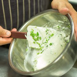 Fresh tarragon is blended into the Béarnaise cheese which is allowed to set.