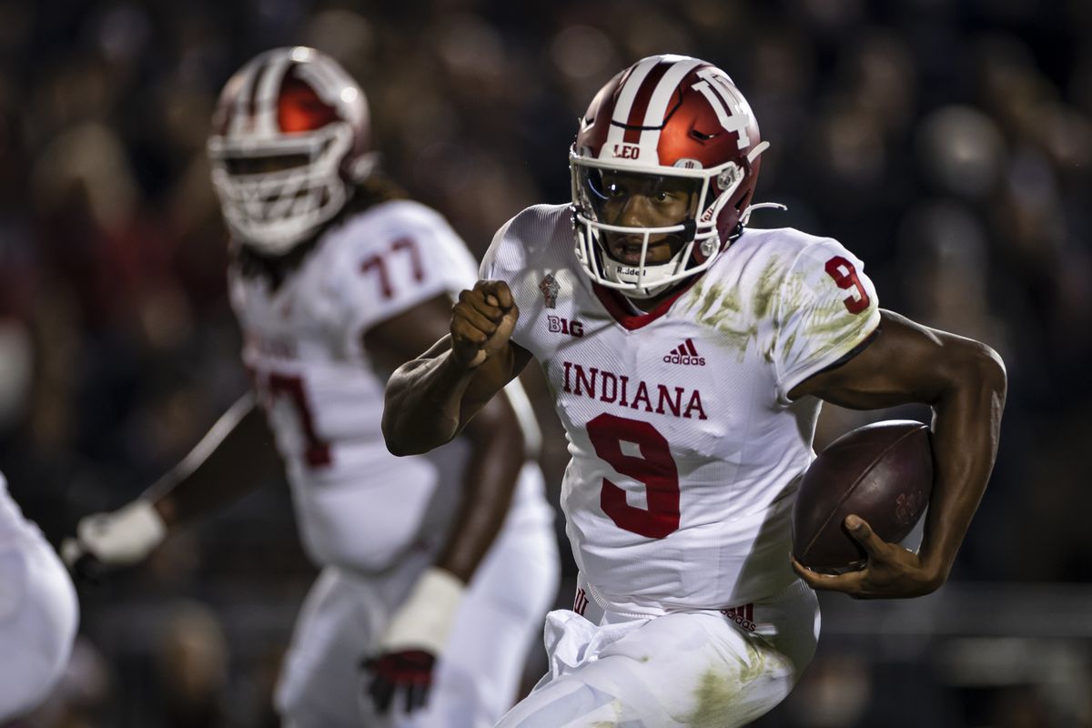 Michael Penix Jr. of the Indiana Hoosiers scrambles against the Penn State Nittany Lions during the second half at Beaver Stadium on October 2, 2021 in State College, Pennsylvania.