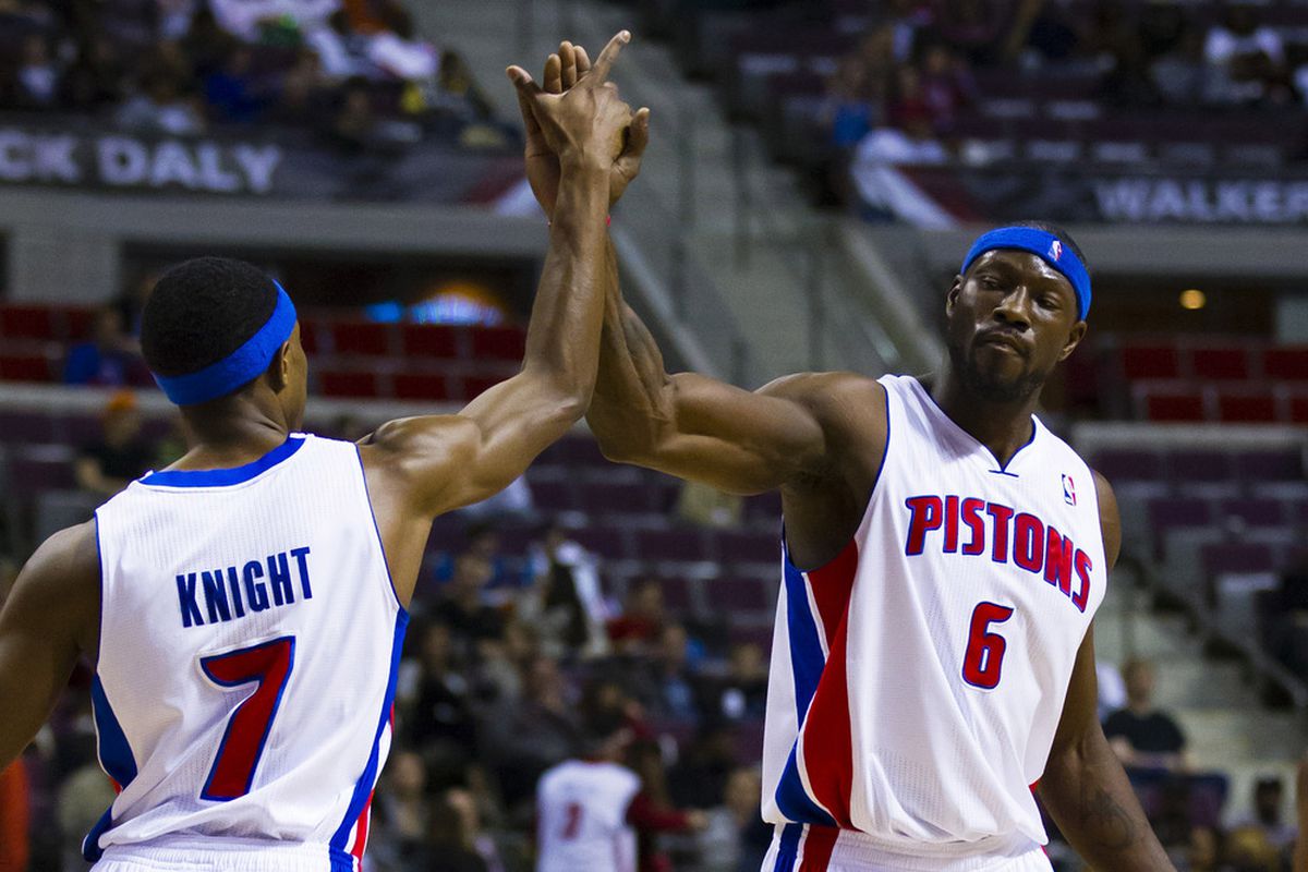 April 26, 2012; Auburn Hills, MI, USA; Detroit Pistons point guard Brandon Knight (7) and center Ben Wallace (6) high five in the first quarter against the Philadelphia 76ers at The Palace. Mandatory Credit: Rick Osentoski-US PRESSWIRE