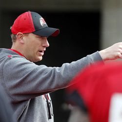 Jim Harding directs during warmup for a University of Utah football scrimmage in Salt Lake City, Friday, April 4, 2014.