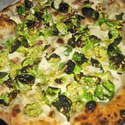 Brussels sprouts pizza from Motorino by <a href="http://www.flickr.com/photos/chekmarkeats/6396739603/in/pool-eater/">Chekmark Eats</a>.