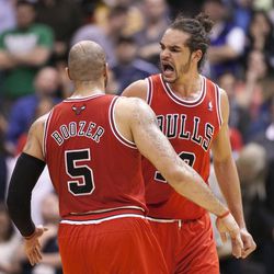 Chicago's Joakim Noah and Carlos Boozer celebrate as the Jazz and the Bulls play Friday, Feb. 8, 2013 at Energy Solutions arena. Chicago won 93-89.