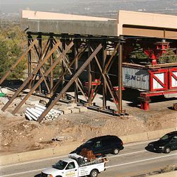 Traffic passes along I-215 east near 4500 South as construction workers prep the area for the new bridge to be put in place over the weekend. The 4500 South bridge will close at noon today, and will reopen in approximately 10 days.