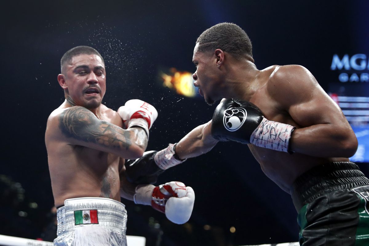  WBC lightweight champion Devin Haney (R) punches Joseph Diaz Jr. in a title fight at MGM Grand Garden Arena on December 04, 2021 in Las Vegas, Nevada. 