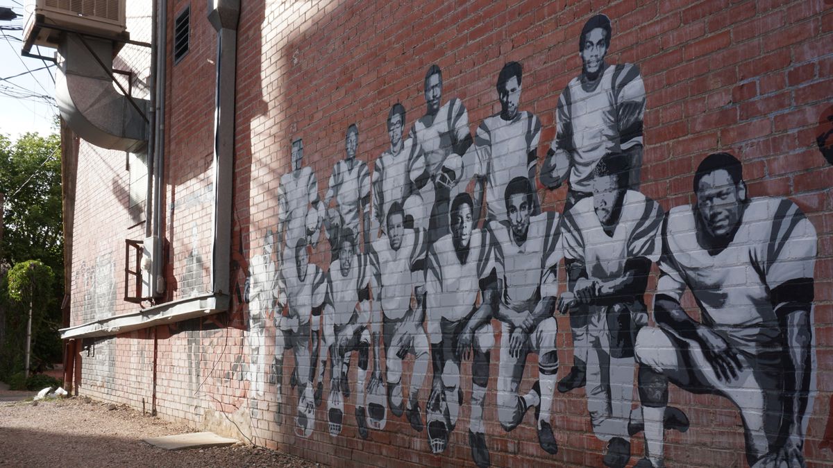 A mural in a downtown Laramie, Wyoming, alley honors the Black 14 in a photo taken on Sept. 11, 2019.