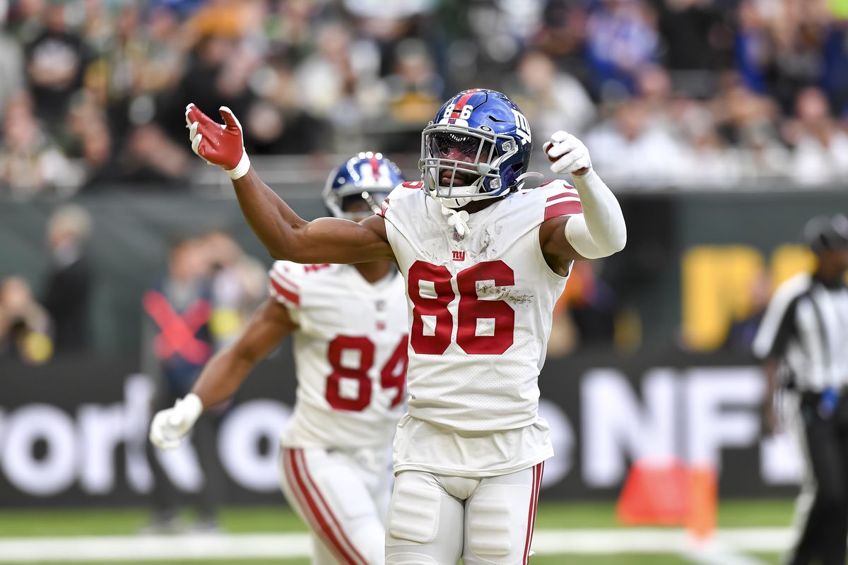 LONDON, ENGLAND - OCTOBER 09: Darius Slayton of New York Giants celebrates the touchdown with his his teammates during the NFL match between New York Giants and Green Bay Packers at Tottenham Hotspur Stadium on October 9, 2022 in London, England.