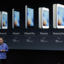 Greg Joswiak, vice president of iOS, iPad and iPhone product marketing, announces the new iPhone SE at Apple headquarters Monday, March 21, 2016, in Cupertino, Calif. 