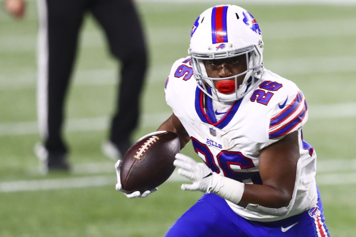Devin Singletary #26 of the Buffalo Bills runs with the ball during a game against the Buffalo Bills at Gillette Stadium on December 28, 2020 in Foxborough, Massachusetts.