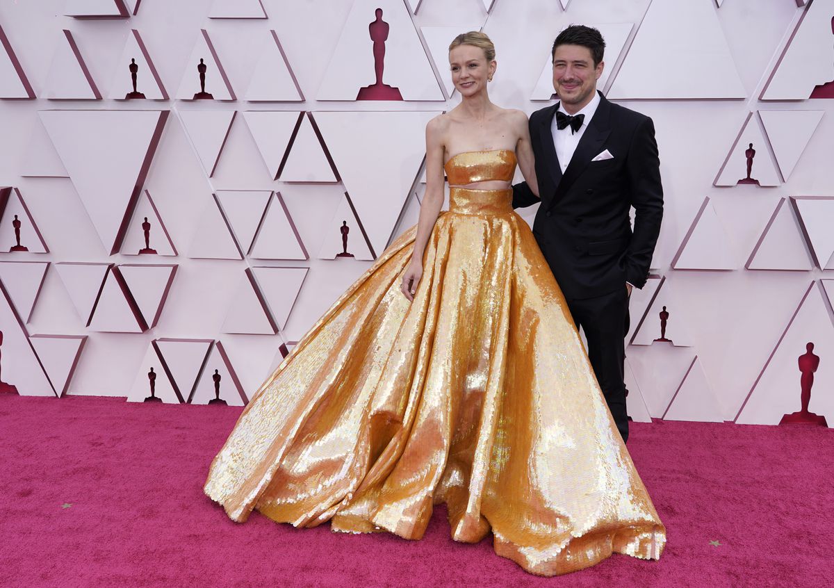 Carey Mulligan and Marcus Mumford arrive at the Oscars on Sunday, April 25, 2021, at Union Station in Los Angeles.