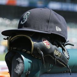 DETROIT, MI - SEPTEMBER 1: A Seattle Mariners cap and glove before a game against the Detroit Tigers at Comerica Park on September 1, 2022, in Detroit, Michigan.