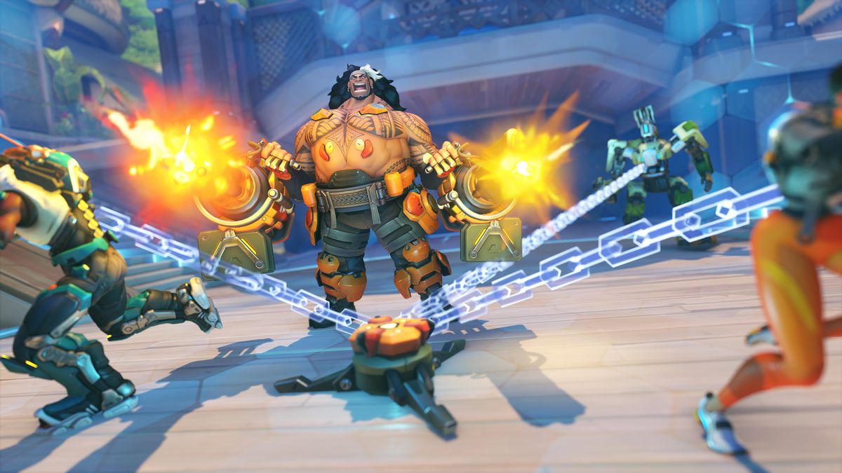 Overwatch 2 hero Mauga ensnares Tracer, Baptiste, and Bastion with his Cage Fight ultimate ability
