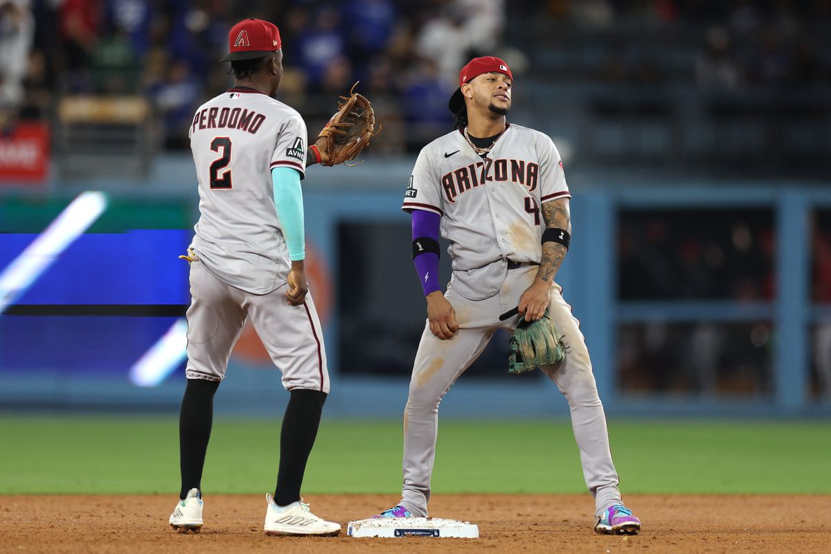 Geraldo Perdomo and Ketel Marte of the Arizona Diamondbacks celebrate after defeating the against the Los Angeles Dodgers in Game Two of the Division Series at Dodger Stadium on October 09, 2023 in Los Angeles, California.