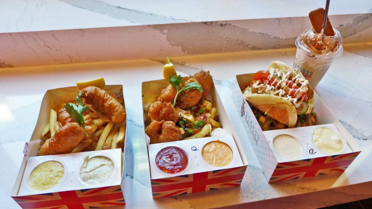 Three fast food boxes with the fries on the bottom.