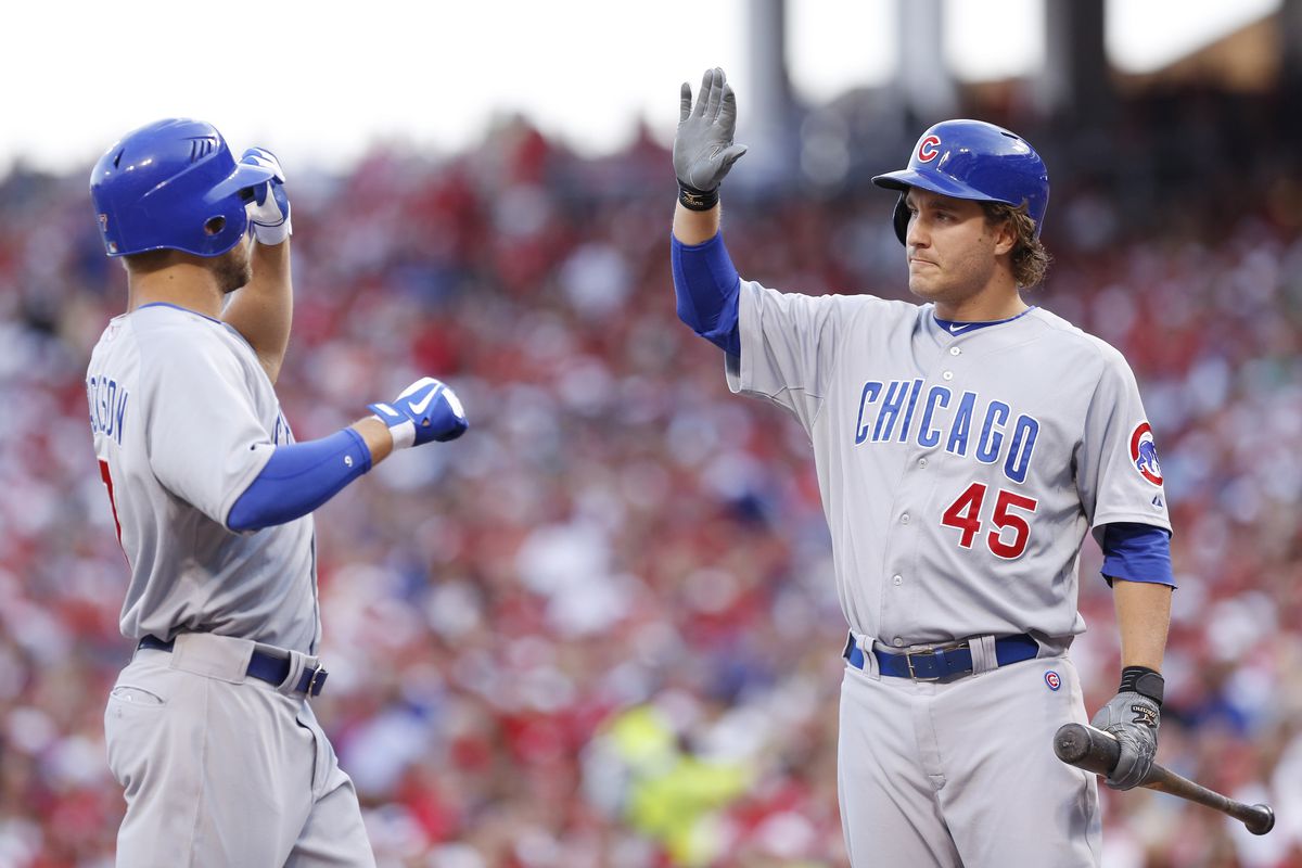 Brett Jackson of the Chicago Cubs celebrates with Adrian Cardenas after hitting a home run during game two of a doubleheader against the Cincinnati Reds at Great American Ball Park in Cincinnati, Ohio. (Photo by Joe Robbins/Getty Images)