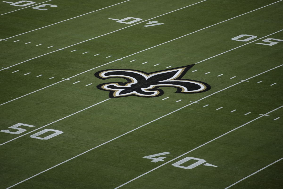 The New Orleans Saints logo is seen on the field before the start of a game against the Green Bay Packers at TIAA Bank Field on September 12, 2021 in Jacksonville, Florida.