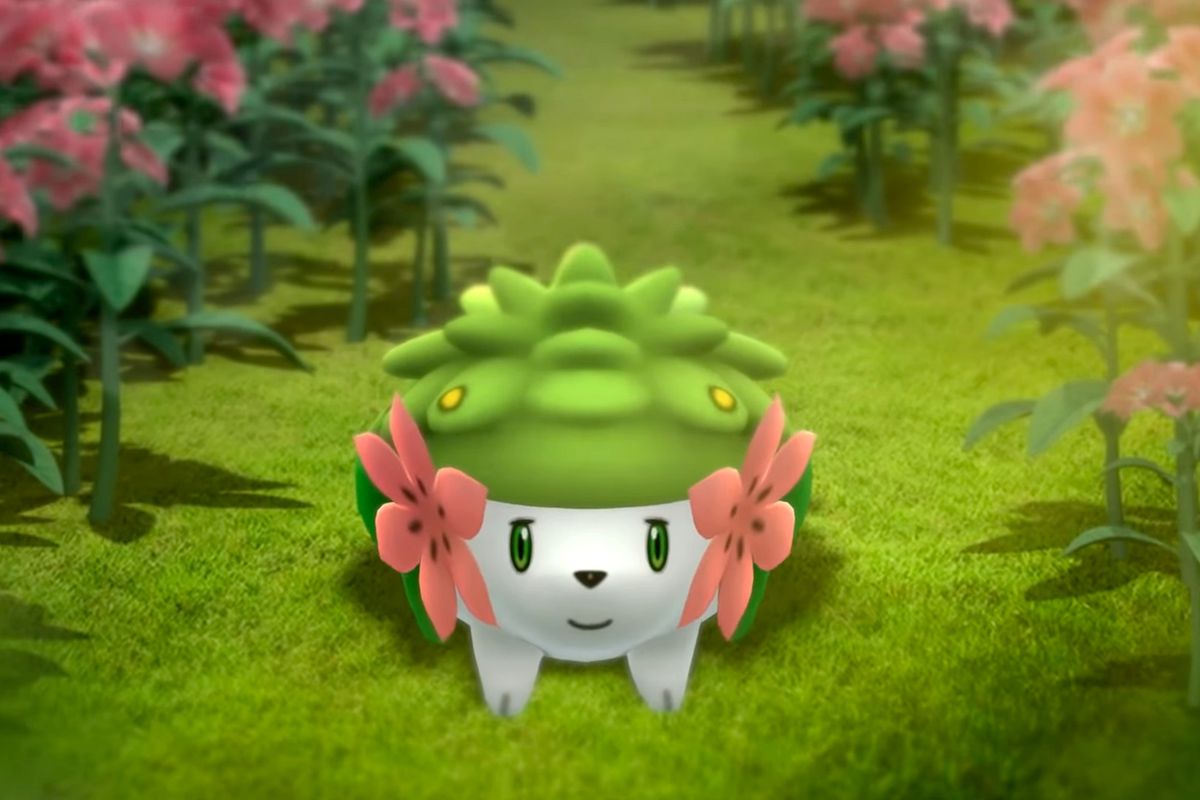 Shaymin between pink flowers in Pokémon Go