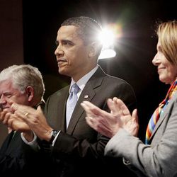 President Barack Obama, center, during his visit to Capitol Hill to meet with House Democrats in Washington, Saturday. With Obama are Rep. John B. Larson, D-Conn., left, and Speaker of the House Nancy Pelosi, D-Calif., right.