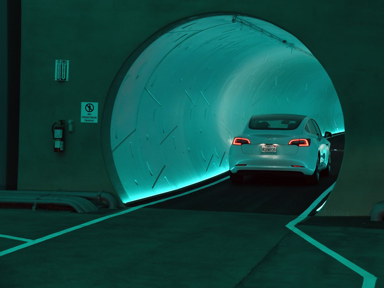 A car driving into a tunnel.