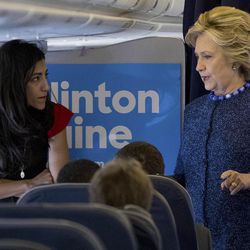 FILE - In this Oct. 28, 2016 file photo, Democratic presidential candidate Hillary Clinton speaks with senior aide Huma Abedin aboard her campaign plane at Westchester County Airport in White Plains. Amid the 2016 presidential campaign, the FBI conducted an investigation into Clinton's use of a private computer server to handle emails she sent and received as secretary of state. FBI Director James Comey criticized Clinton for carelessness but said the bureau would not recommend criminal charges.