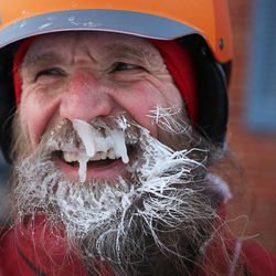 In a Feb.19, 2014 photo, Fraser Cunningham, 56, a GE engineer, arrives home in Madeira, Ohio, with a frozen beard. He calls it his "chinsulation." Cunningham hasn't missed a day biking to and from work for a year and a half.