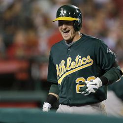 Oakland Athletics' Josh Donaldson reacts to his two run home run against the Los Angeles Angels during the sixth inning of a baseball game in Anaheim, Calif., Thursday, April 11, 2013. 