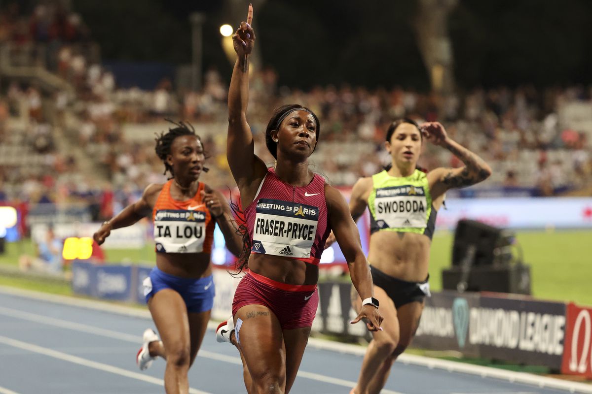 Shelly-Ann Fraser-Pryce of Jamaica celebrates winning the 100m. left Marie-Josee Ta Lou of Ivory Coast, Ewa Swoboda of Poland during the Meeting de Paris 2022, part of the Wanda Diamond League series at Stade Charlety on June 18, 2022 in Paris, France.