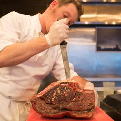 Chef Rudofker takes a knife to the aged rib primal.