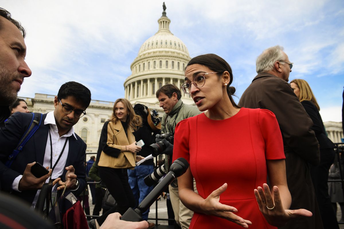 November 14: Alexandria Ocasio-Cortez (D-N.Y.) talks with reporters following a photo opportunity on Capitol Hill with the in-coming freshman class. (Susan Walsh/AP)